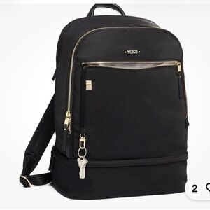 Tumi Backpack in Black with Gold Details and multiple components